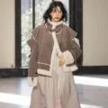 Ujoh Fall 2026 Collection, Layered Tailoring, Asymmetric Capes, and Sheer Knit Fabrics