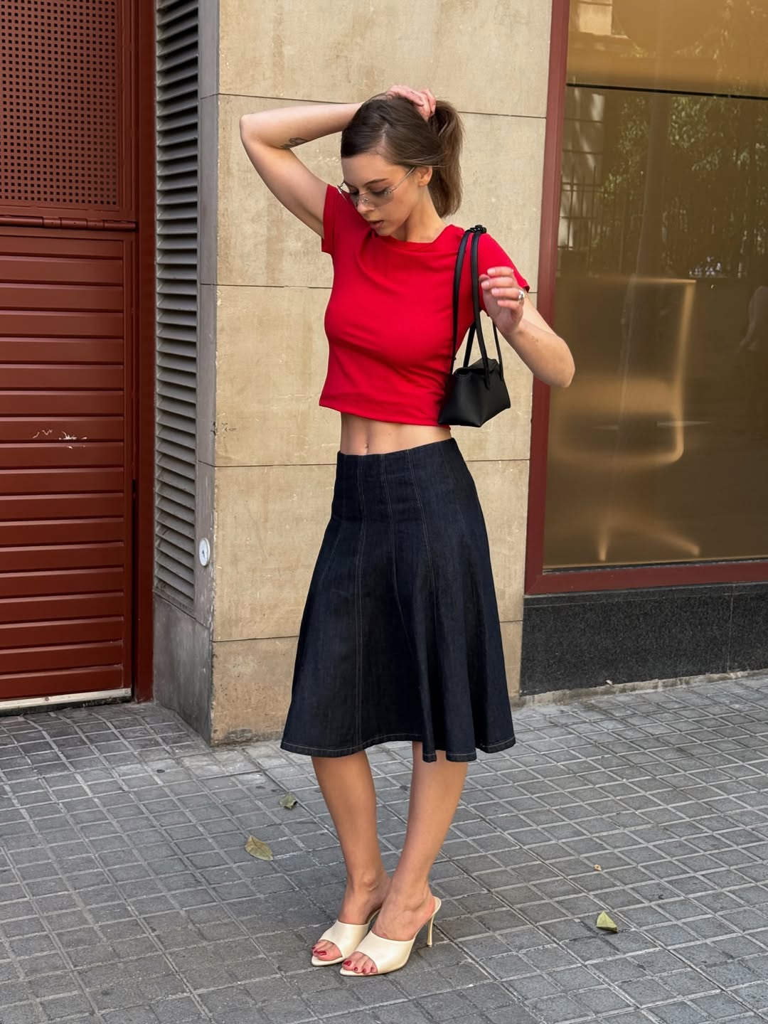 Fashion Blogger Wearing A Denim Skirt