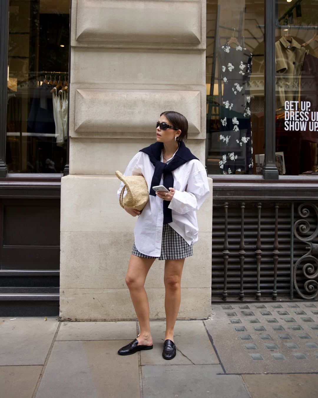 Fashion Blogger Wearing White Pull On Pants With A Black Cardigan