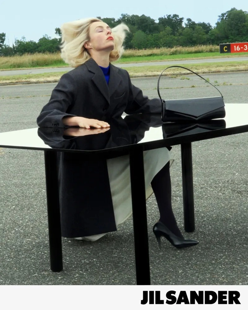 Jil Sander Fall 2026 Turns An Airfield Into A Very Strange Living Room