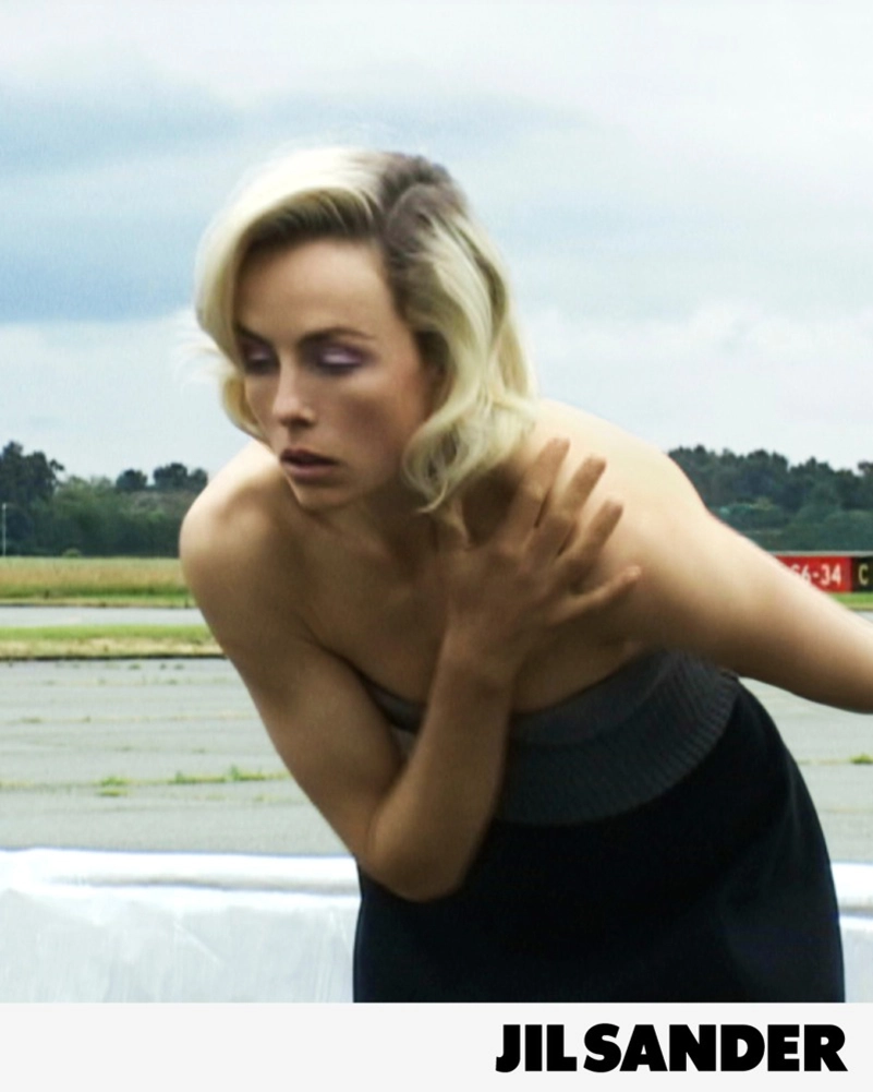 Jil Sander Fall 2026 Turns An Airfield Into A Very Strange Living Room