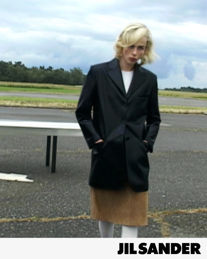 Jil Sander Fall 2026 Turns An Airfield Into A Very Strange Living Room