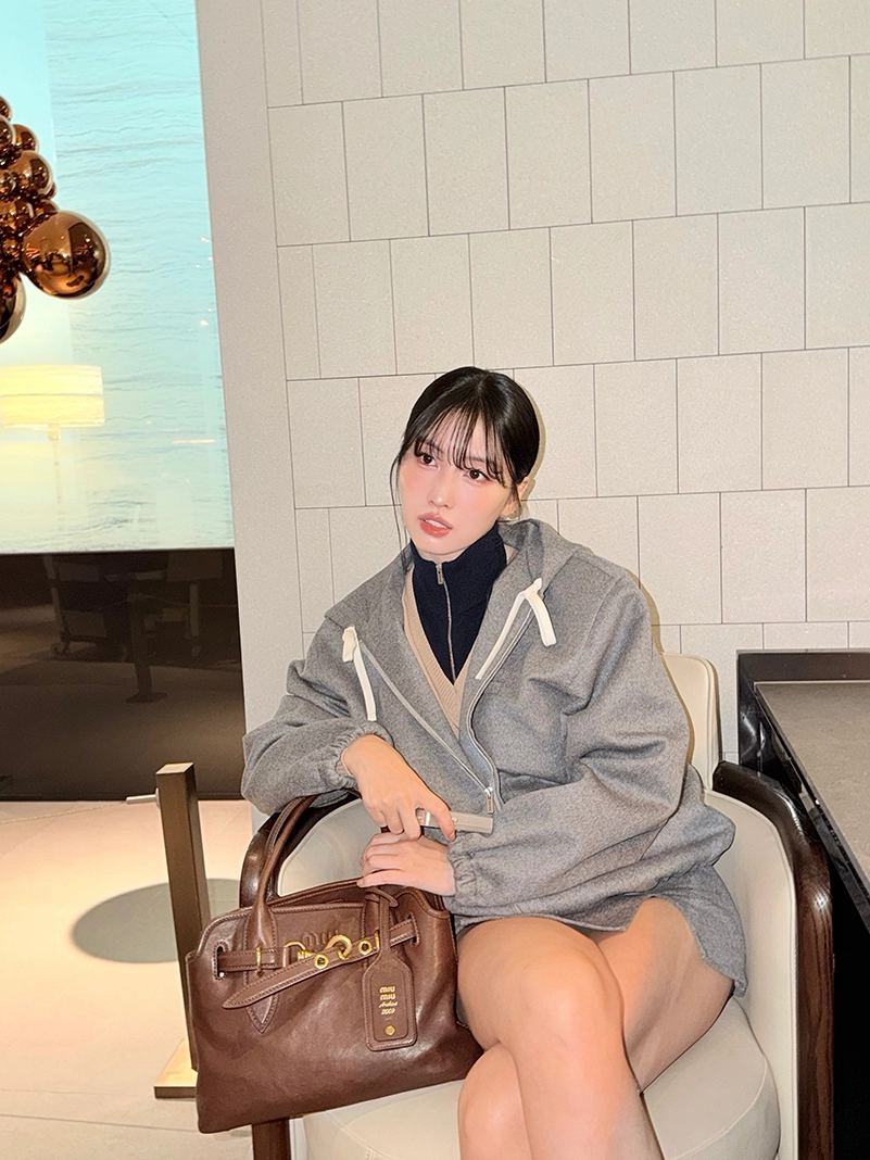 Momo Heads To Miu Miu’s Spring 2027 Show In A Gray Mini And Hoodie #Getthelook