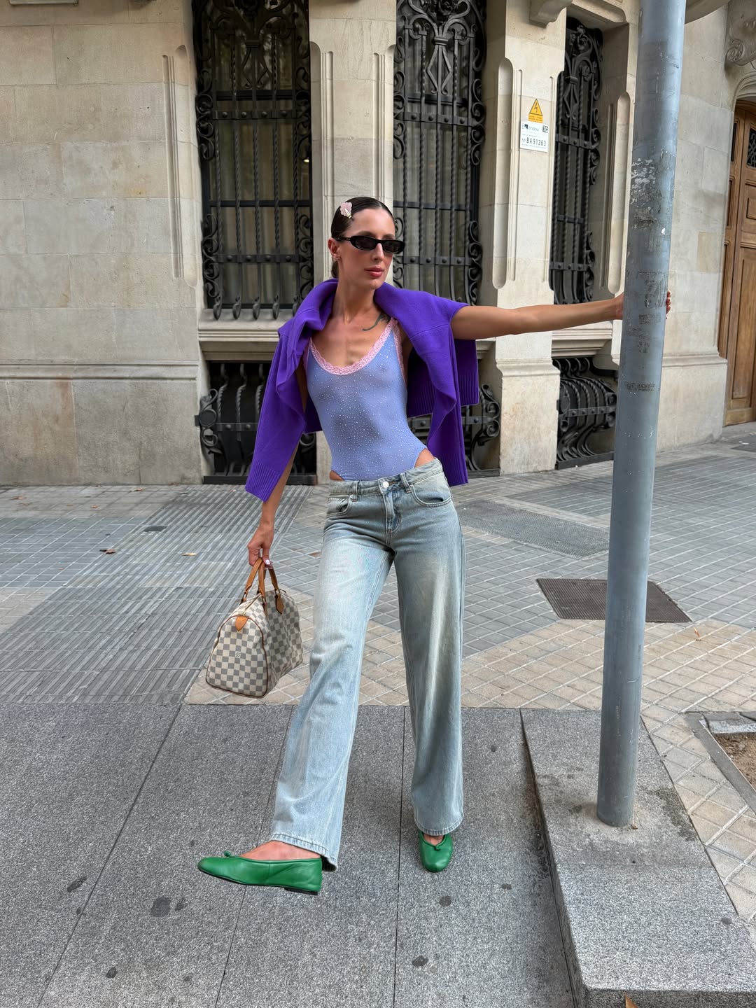 Purple Sweater Worn Over The Shoulders